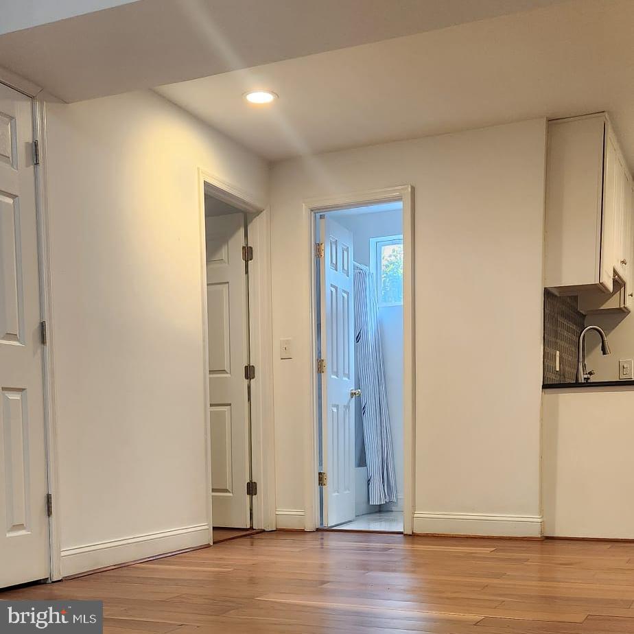 1134 12th Street Laurel, MD 20707 - Photo 8 of 13 a view of a livingroom with wooden floor