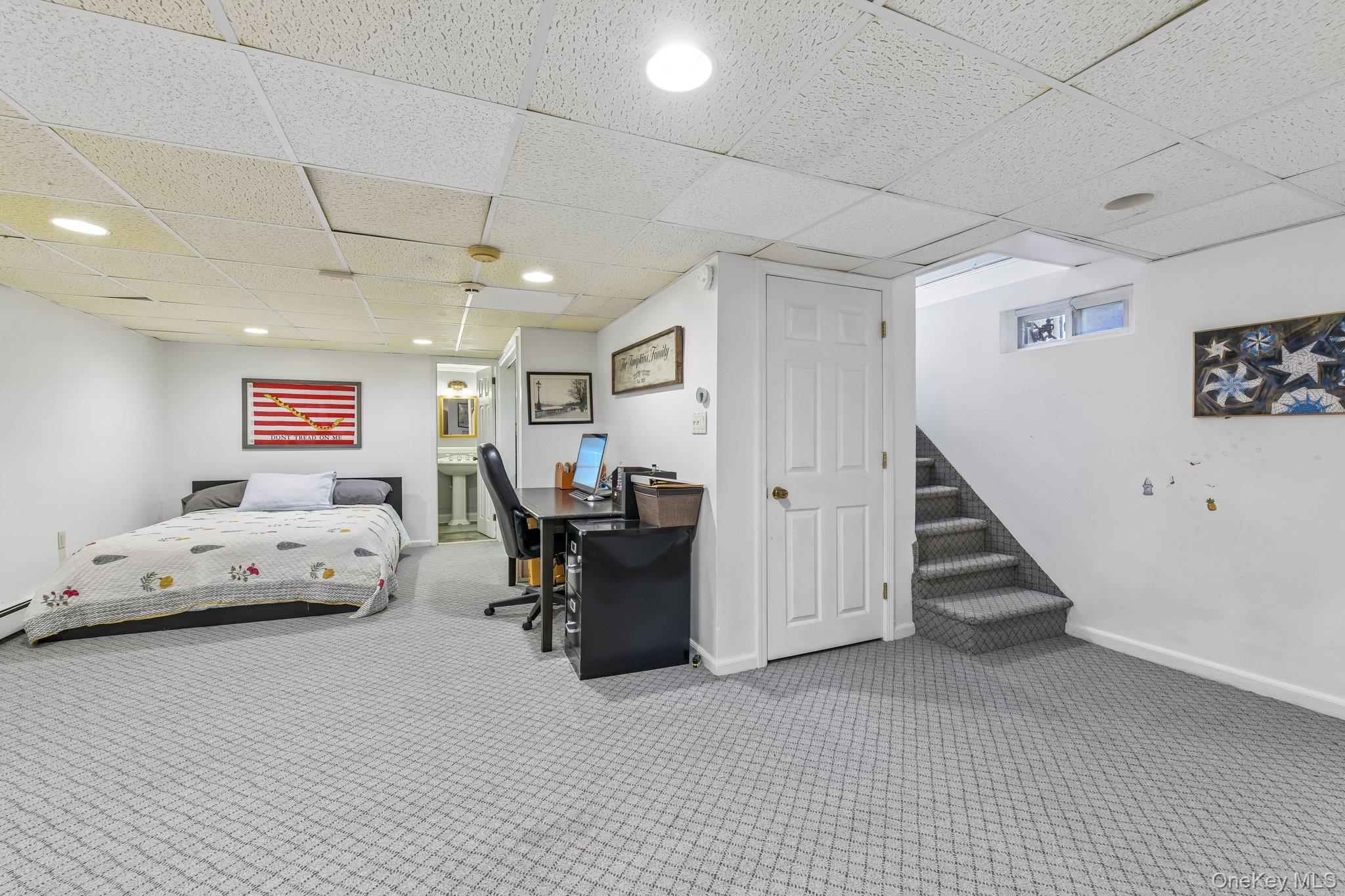 60 Croyden Road Mineola, NY 11501 - Photo 26 of 33 Finished lower level featuring patterned carpeting, recessed lighting, and a drop ceiling