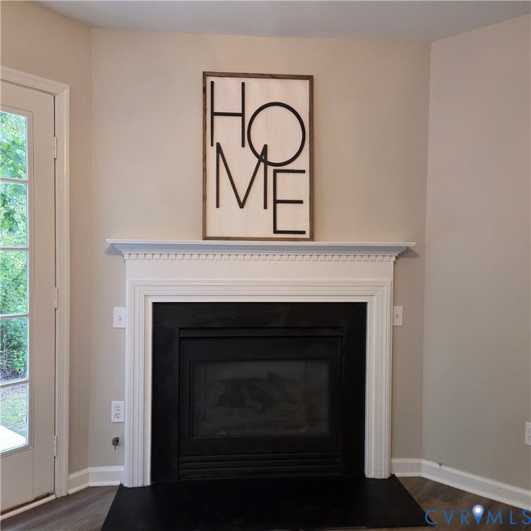 Elegant fireplace with crisp white surround and de