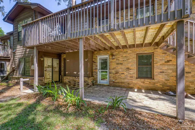a view of backyard with wheel chair and potted plants