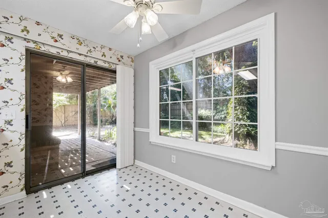 a view of a room that has a large window