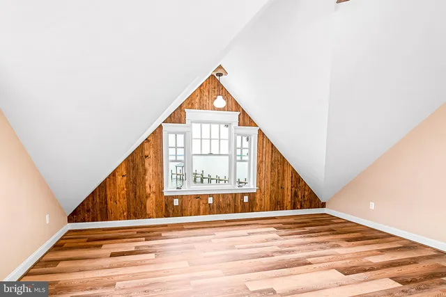 a bathroom with a sink toilet and window