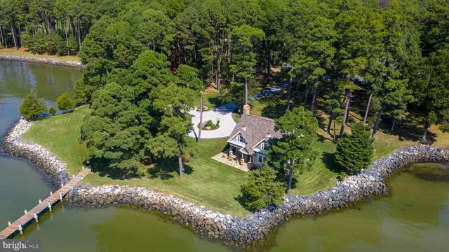 an aerial view of a house with a lake view
