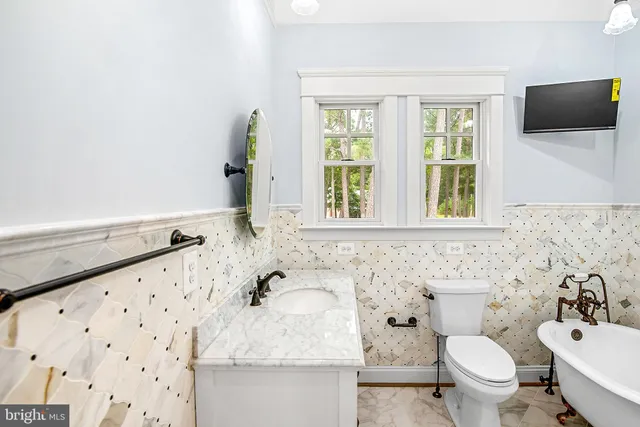 a view of a kitchen counter space and windows
