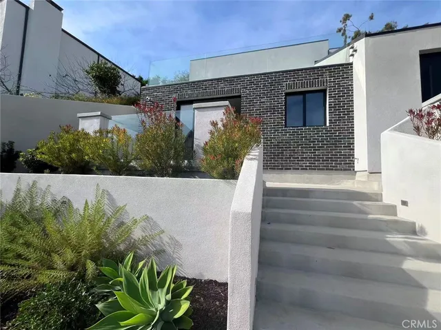 a view of entryway with flower pots