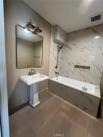 a bathroom with a sink and mirror