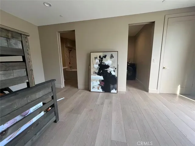 a view of a livingroom with furniture and an entryway