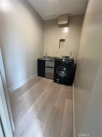 a bedroom with a bed and a lamp on the table