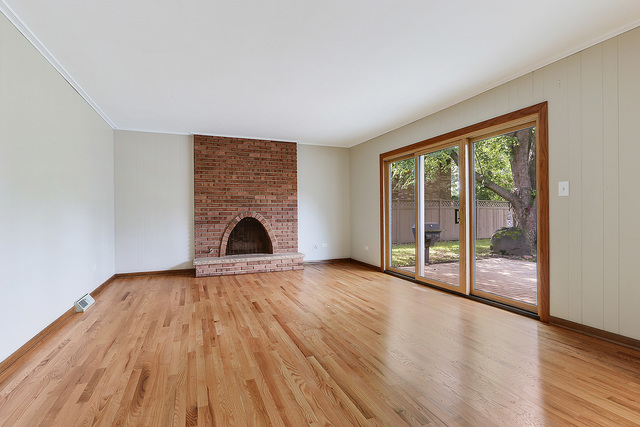 13000 Winnebago Road Palos Heights, IL 60463 - Photo 7 of 15 wooden floor fireplace and natural light in room
