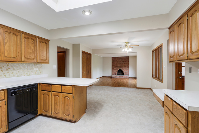 13000 Winnebago Road Palos Heights, IL 60463 - Photo 8 of 15 a view of a kitchen with a sink cabinets and a window