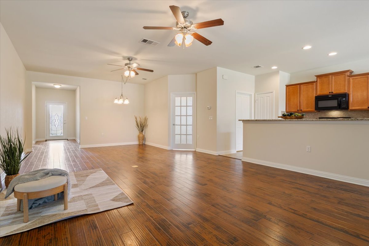 108 Cathedral Mountain Pass Georgetown, TX 78633 - Photo 7 of 36 a living room with furniture and a wooden floor