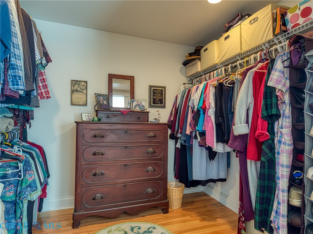 9078 Stump Point Road Hayes, VA 23072 - Photo 20 of 28 Walk in closet with light wood finished floors