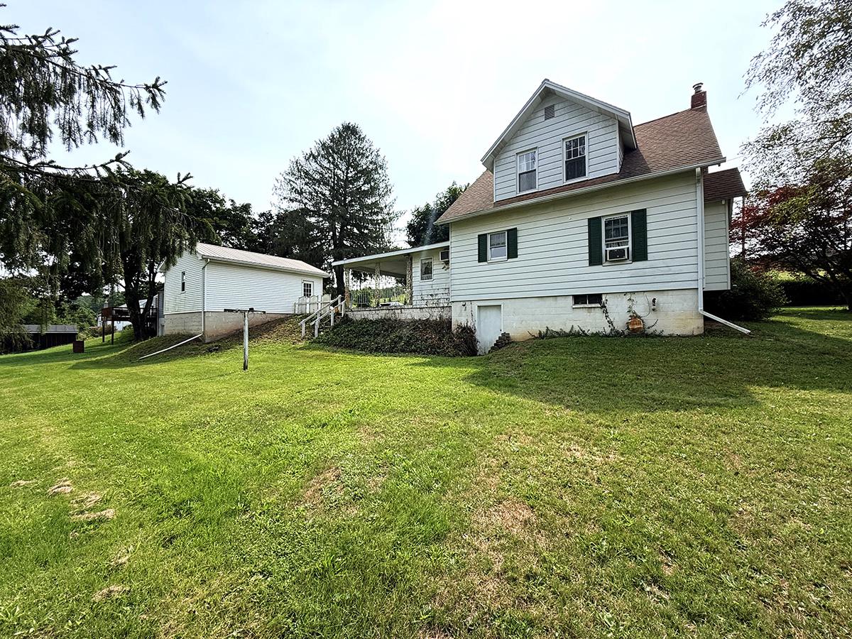6620 Spring Road Shermans Dale, PA 17090 - Photo 40 of 40 Rear view of home from expansive lawn