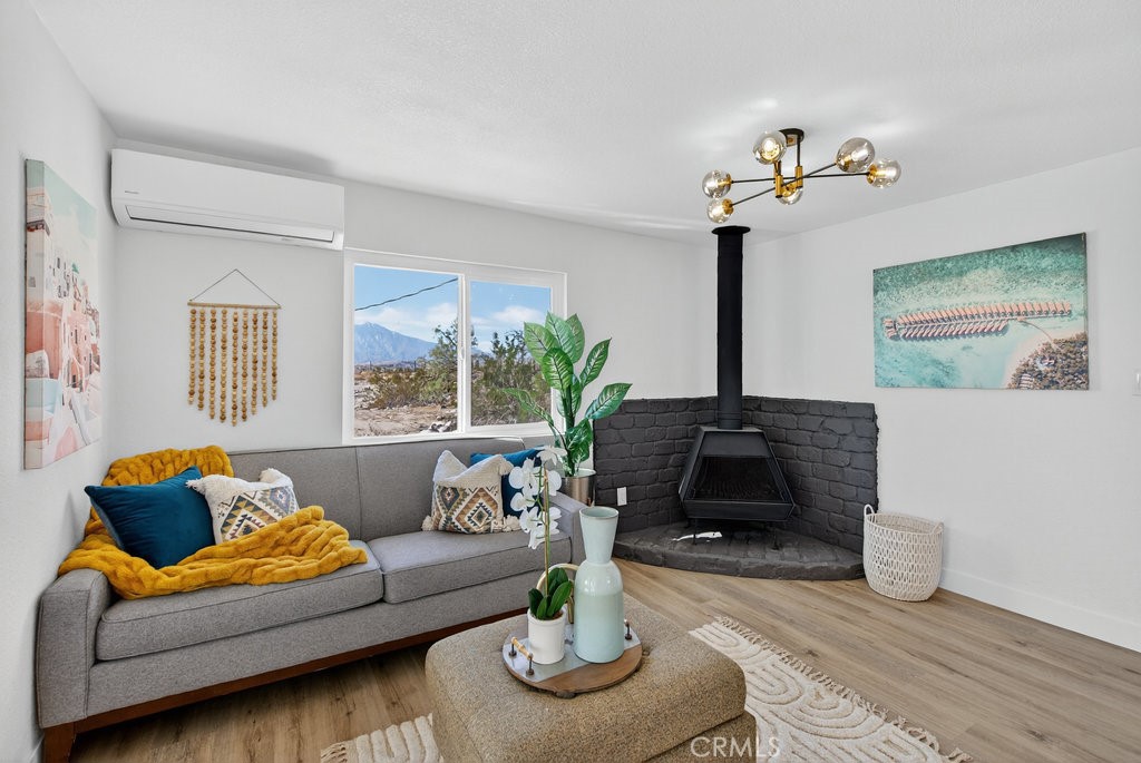 22700 Tamyran Road Desert Hot Springs, CA 92241 - Photo 13 of 65 a living room with furniture flowerpot and window