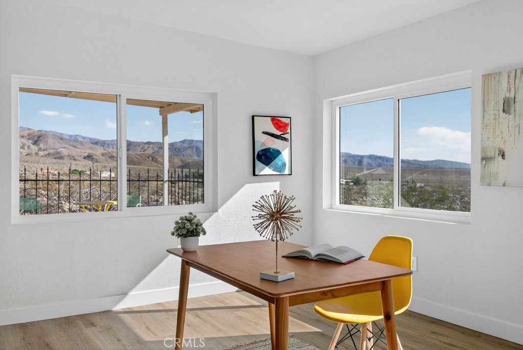 22700 Tamyran Road Desert Hot Springs, CA 92241 - Photo 25 of 65 a workspace with furniture and a potted plant