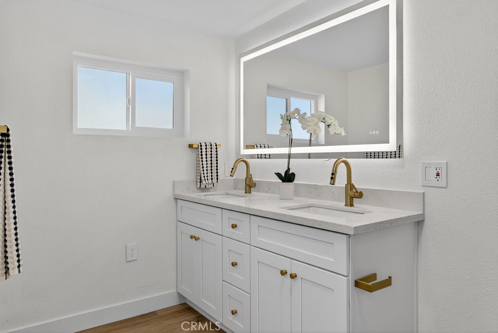 22700 Tamyran Road Desert Hot Springs, CA 92241 - Photo 30 of 65 a bathroom with a sink and mirror