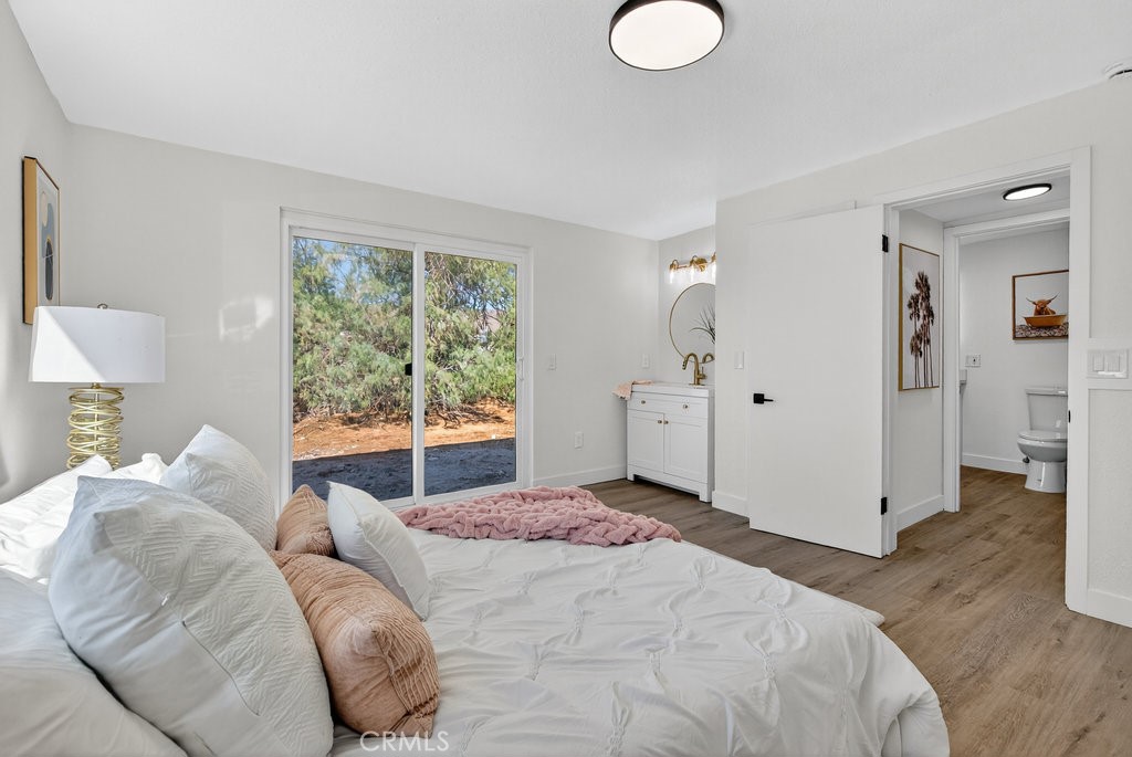 22700 Tamyran Road Desert Hot Springs, CA 92241 - Photo 35 of 65 a bedroom with a bed and a window