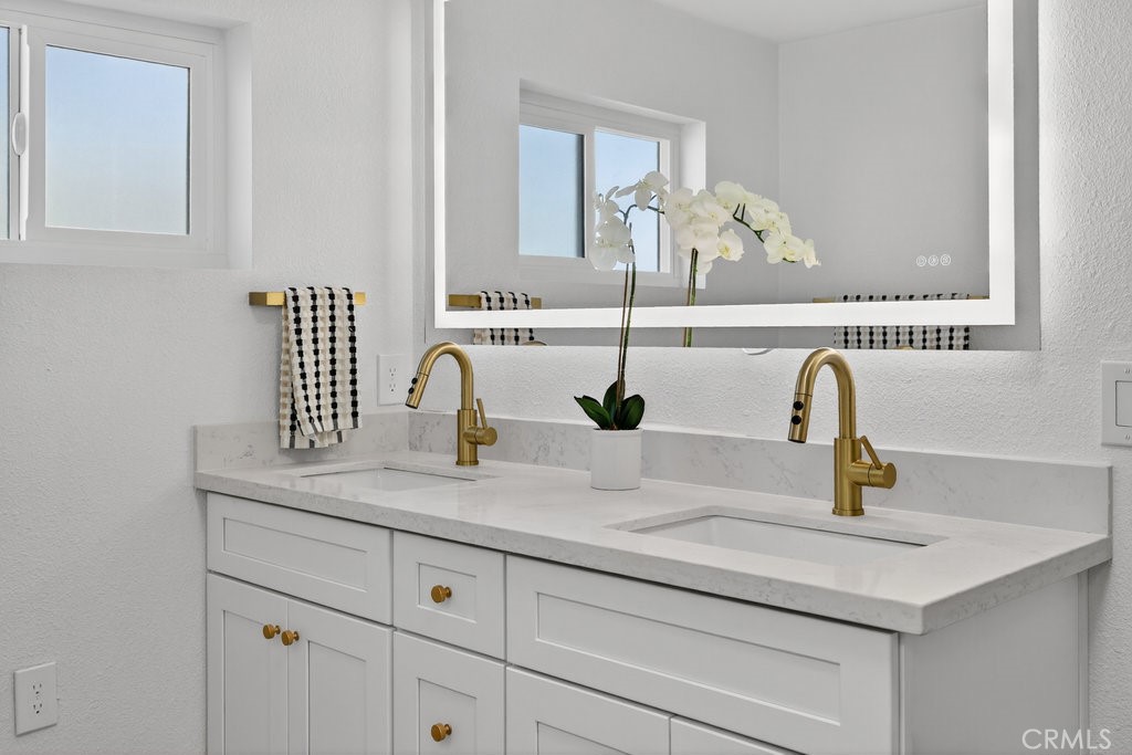 22700 Tamyran Road Desert Hot Springs, CA 92241 - Photo 39 of 65 a bathroom with a sink and a window