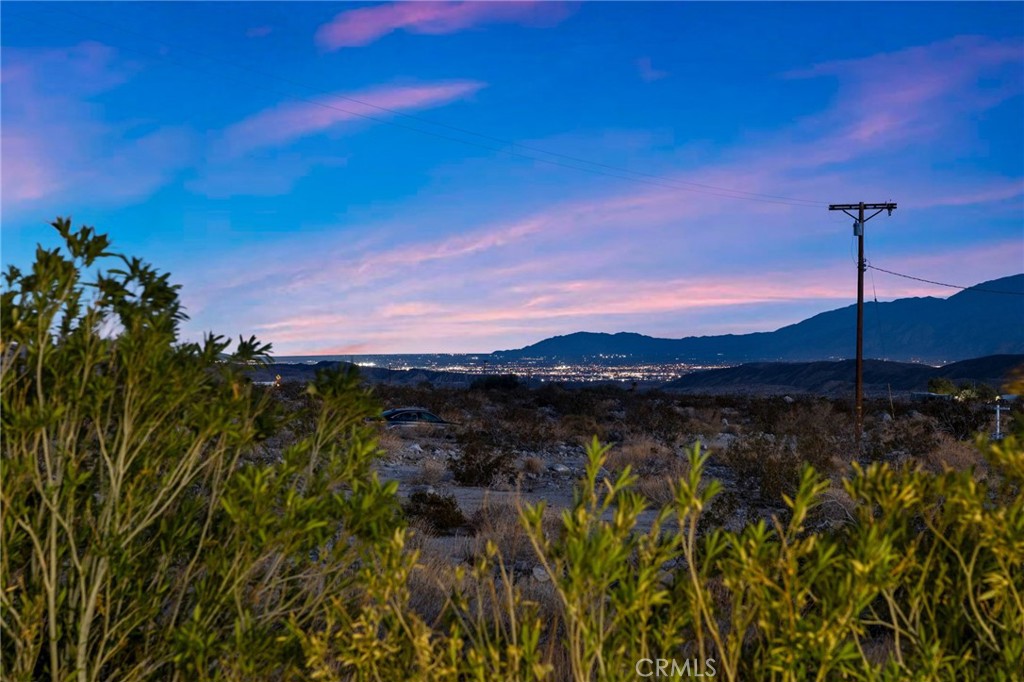 22700 Tamyran Road Desert Hot Springs, CA 92241 - Photo 4 of 65 a view of a lake with a mountain