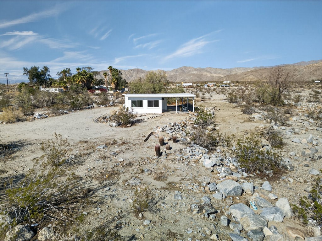 22700 Tamyran Road Desert Hot Springs, CA 92241 - Photo 52 of 65 an aerial view of house with yard