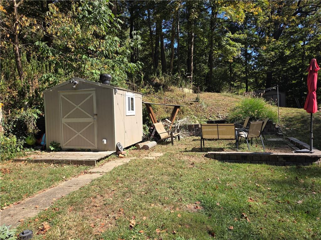 258 Spring Run Road Crescent, PA 15046 - Photo 12 of 48 a backyard of a house with table and chairs