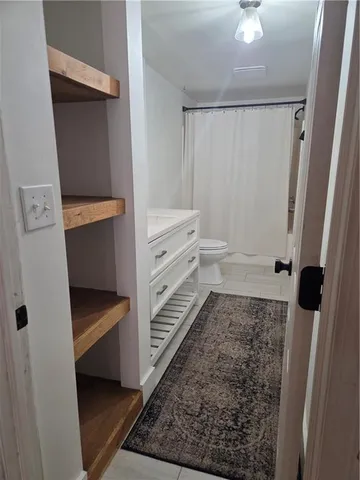 a bathroom with a tub and a shower