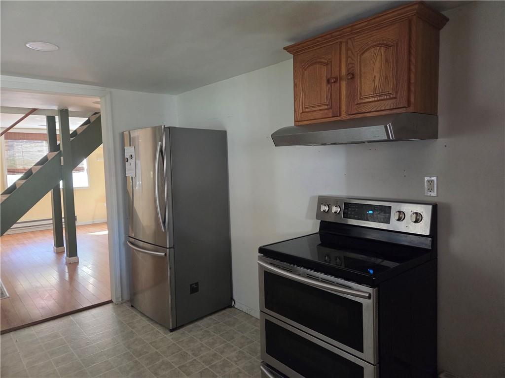 258 Spring Run Road Crescent, PA 15046 - Photo 29 of 48 a kitchen with stainless steel appliances granite countertop a stove microwave and refrigerator