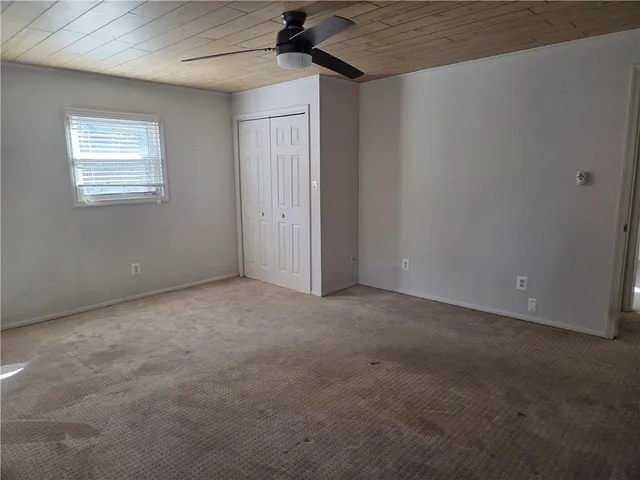 en empty room with windows