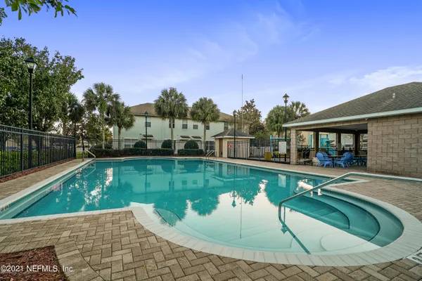 a view of a swimming pool with a patio