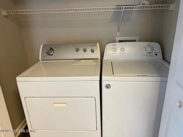 a utility room with dryer and washer