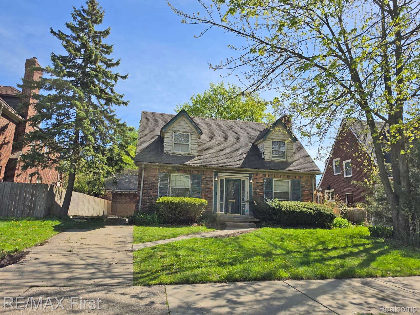 4240 Audubon Road Detroit, MI 48224 - Photo 1 of 1 New england style home featuring brick siding and driveway