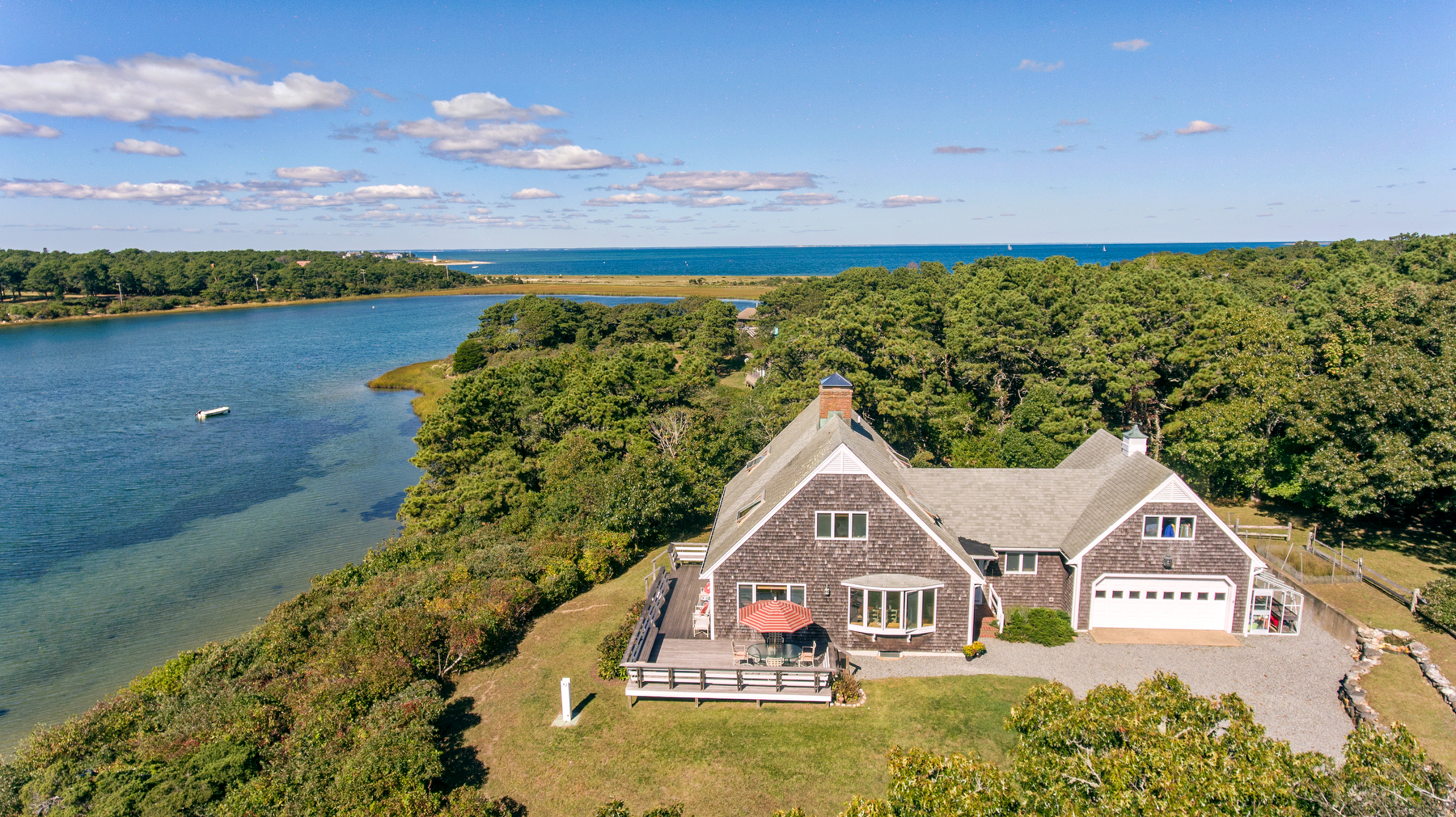 24 Litchfield Road Edgartown, MA 02539 - Photo 6 of 18 a view of a house with a yard and lake view