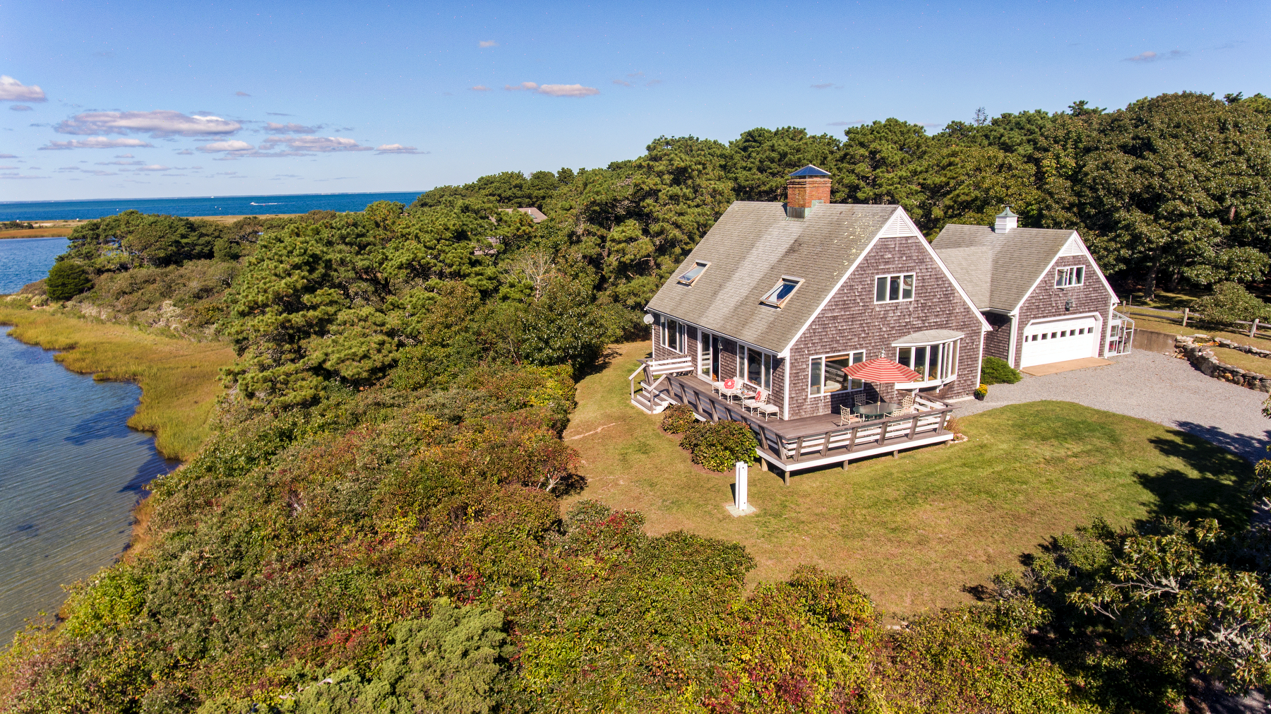 24 Litchfield Road Edgartown, MA 02539 - Photo 7 of 18 a aerial view of a house with a big yard and large trees