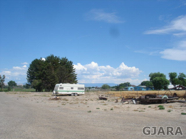 1049-19 19 1/2 Road Fruita, CO 81521 - Photo 2 of 9 a car parked on the side of the road