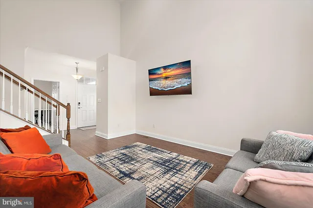 a bathroom with a double vanity sink toilet and a mirror