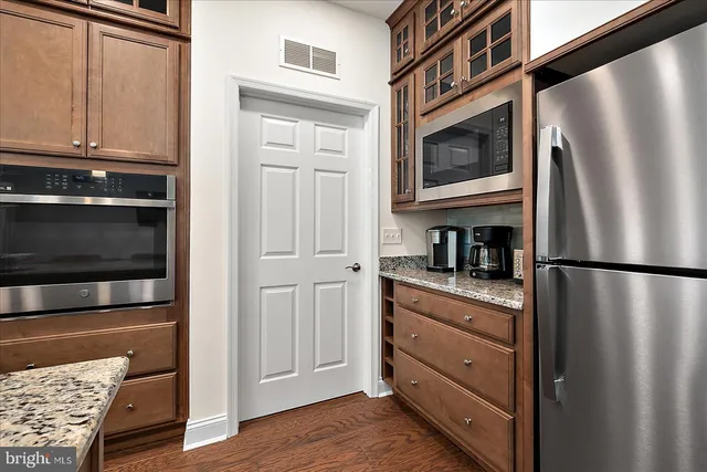 a view of a livingroom with furniture and windows