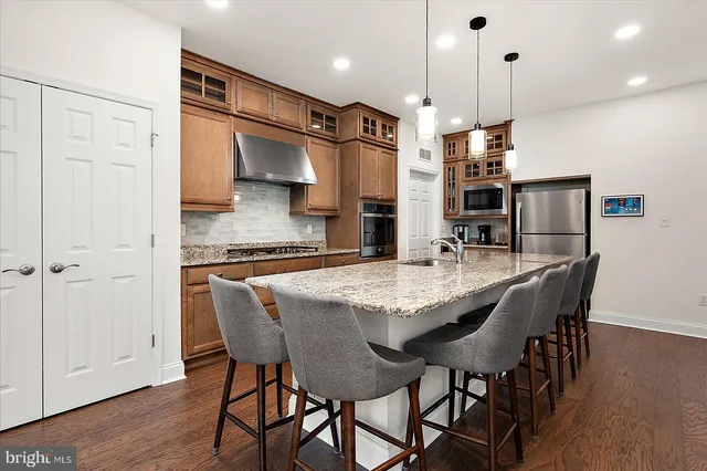 a white toilet sitting next to a shower curtain