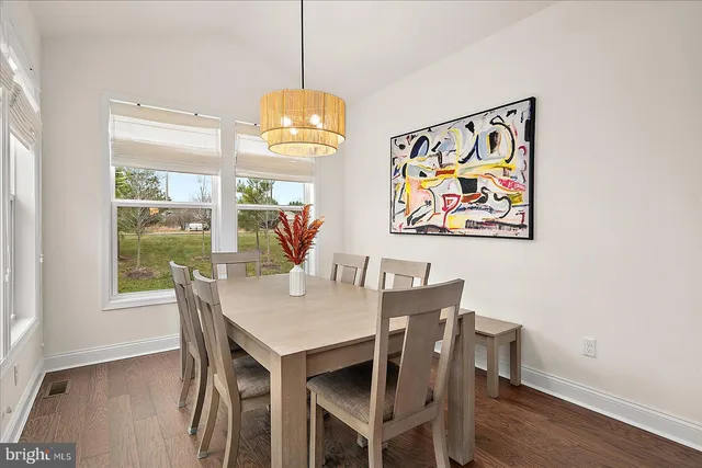 a bathroom with a sink a toilet a mirror and vanity