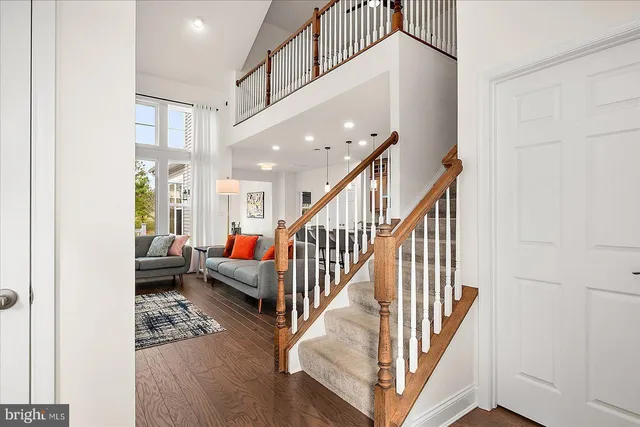 a view of a dining room with furniture wooden floor and chandelier