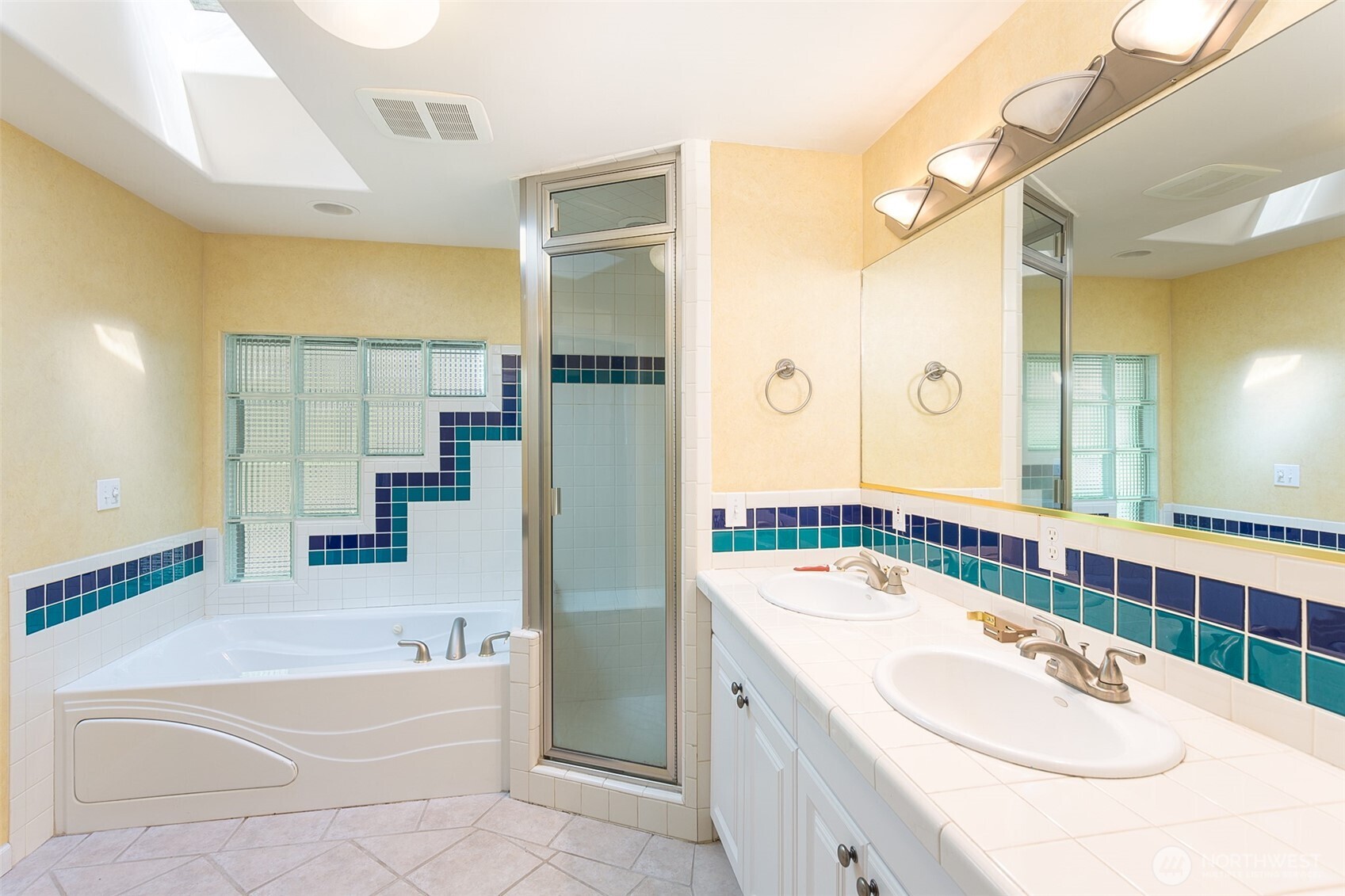123 Forest Ridge Drive Sequim, WA 98382 - Photo 25 of 32 a bathroom with a tub sink and mirror