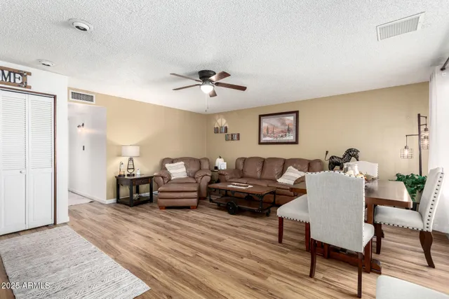 a living room with furniture and a table