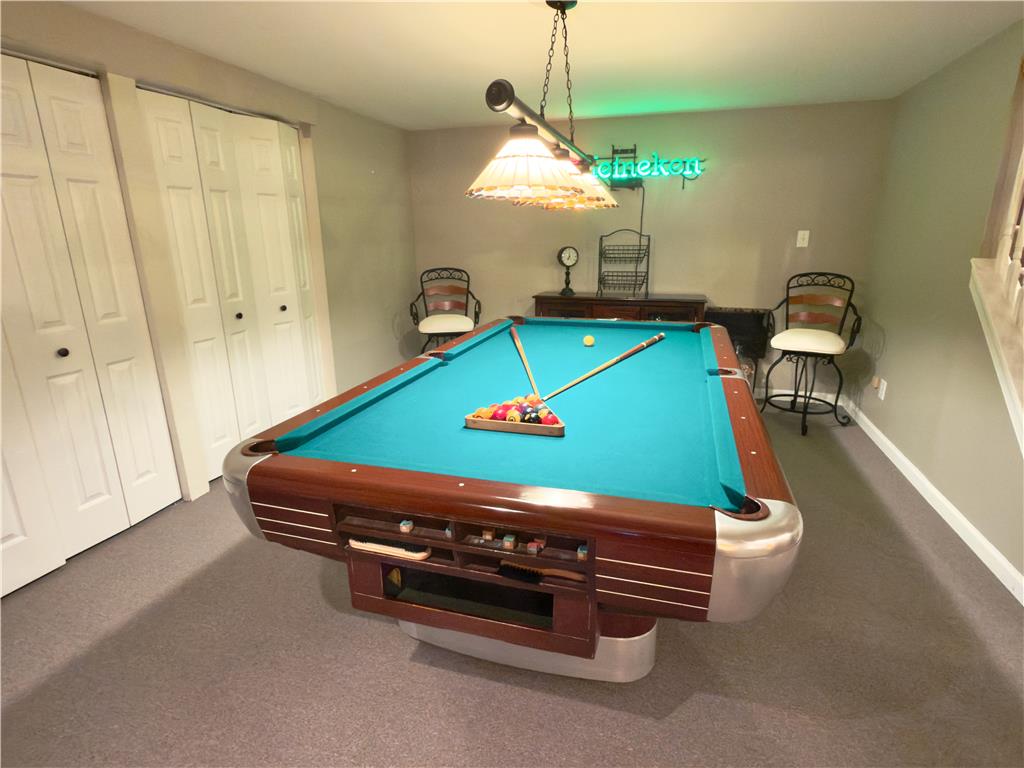4982 Abbey Road Coplay, PA 18037 - Photo 43 of 55 Plush carpeting anchors this versatile recreation space, perfect for entertainment and leisure.