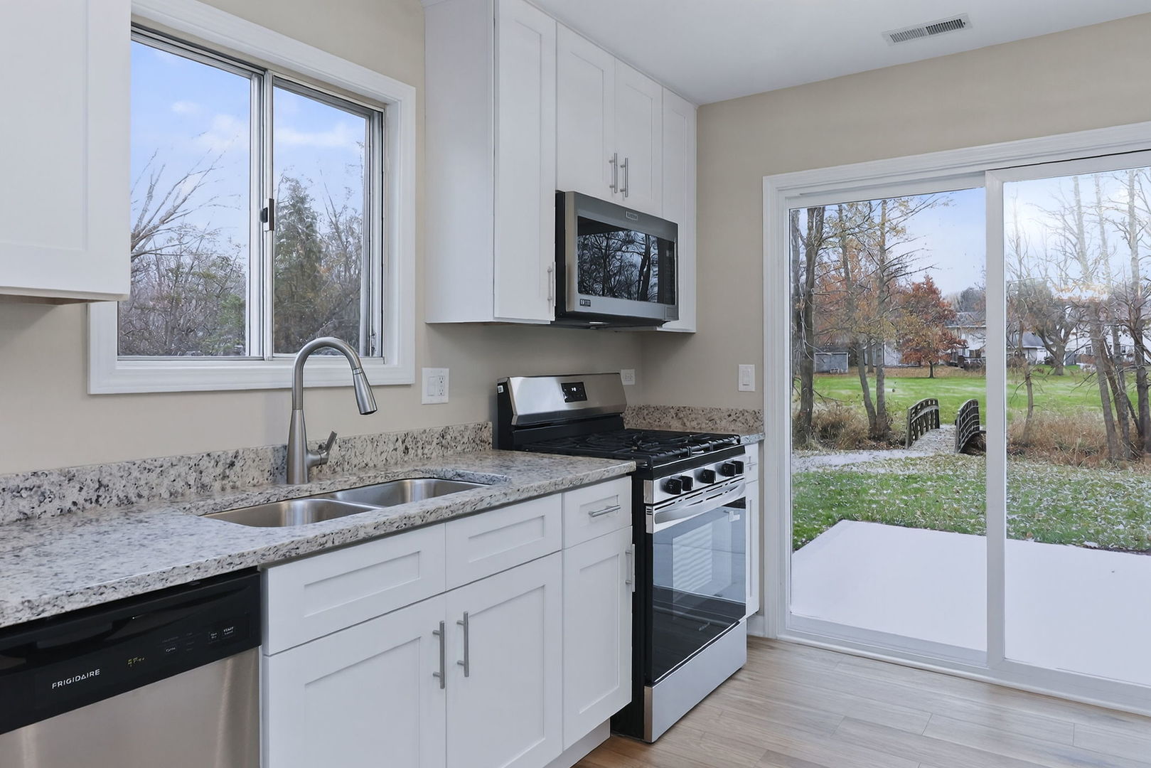 1314 Haverhill Circle Naperville, IL 60563 - Photo 7 of 15 a kitchen with a sink stove and cabinets