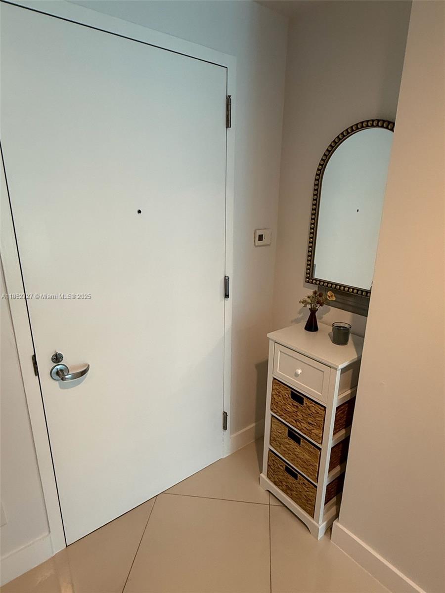 60 Southwest 13th Street, Unit 1418 Miami, FL 33130 - Photo 3 of 9 a view of a room with racks on the wall