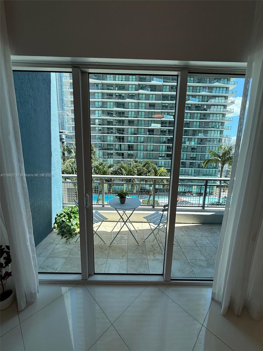 60 Southwest 13th Street, Unit 1418 Miami, FL 33130 - Photo 5 of 9 a view of window in an empty room