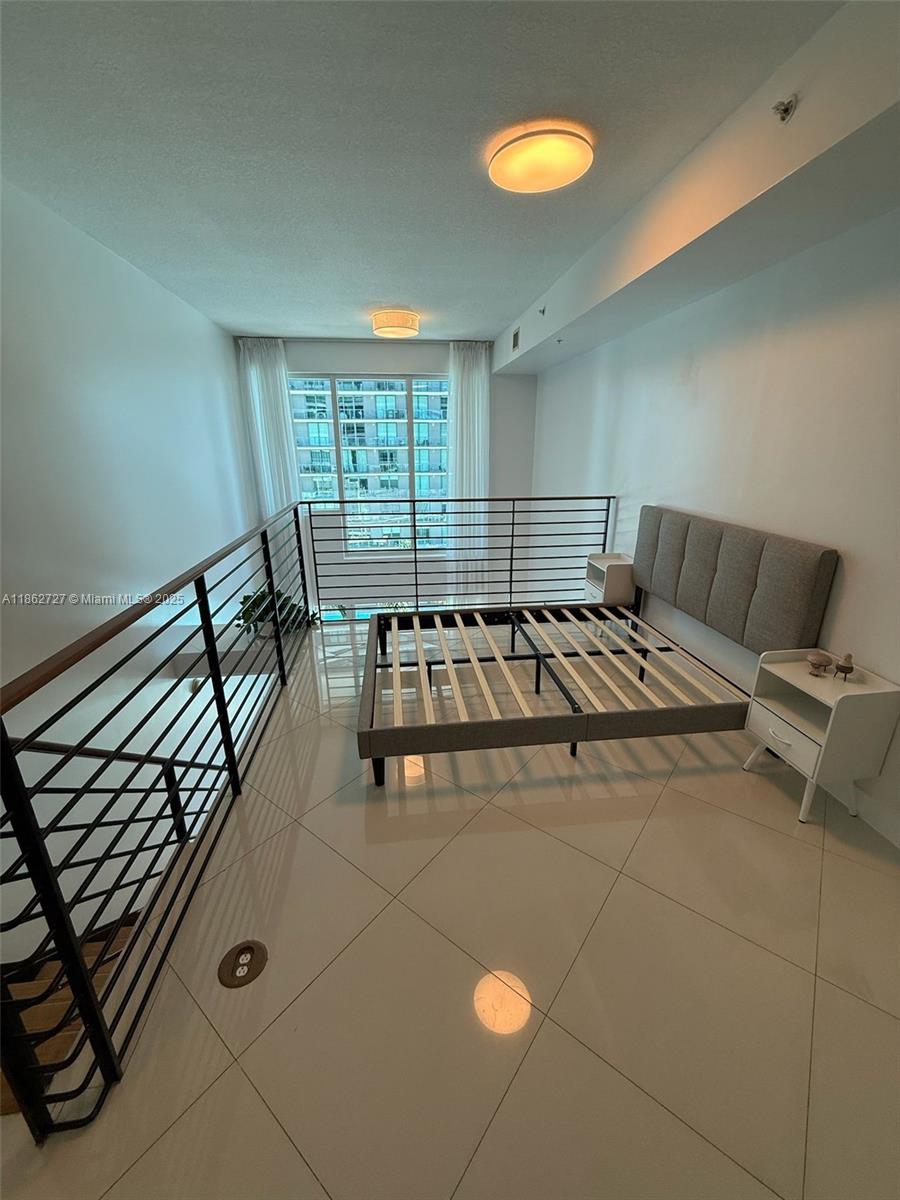 60 Southwest 13th Street, Unit 1418 Miami, FL 33130 - Photo 9 of 9 a view of a room with chairs