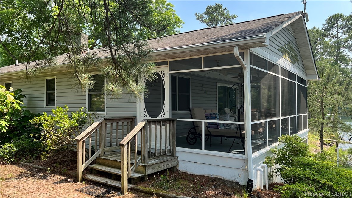 88 Leachwood Road Lancaster, VA 22503 - Photo 31 of 49 a view of deck with chair and potted plants
