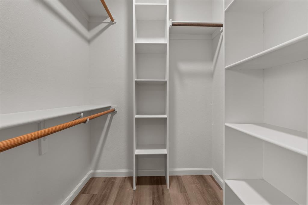 1070 East Reno Road Azle, TX 76020 - Photo 12 of 19 a view of walk in closet with empty racks