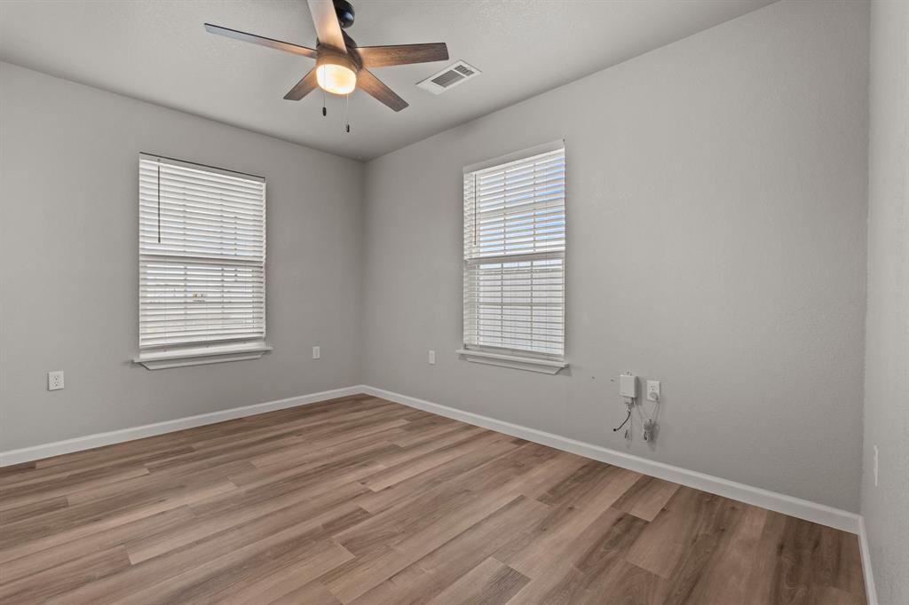 1070 East Reno Road Azle, TX 76020 - Photo 13 of 19 a view of an empty room with a window