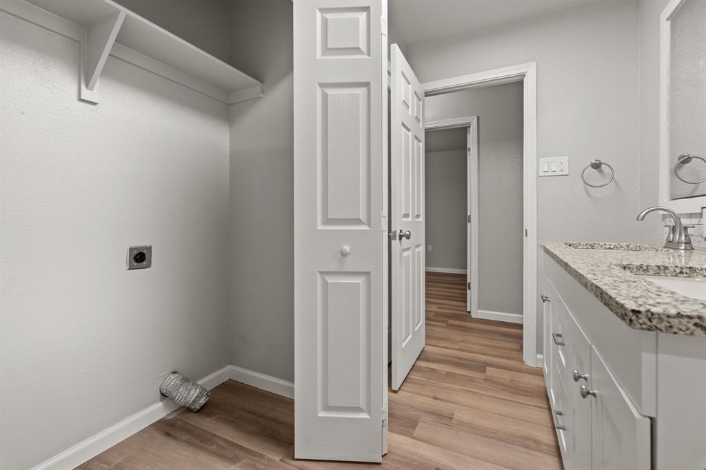 1070 East Reno Road Azle, TX 76020 - Photo 16 of 19 a bathroom with a sink and a mirror